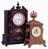 Clocks- 2 (Two): European mantel clocks, the first Austrian, wooden case with rosewood graining and polychrome decoration, Roman numeral white enamel dial, gilt foliate bezel, two day grand sonnerie movement, c1840, Ht 19 1/2". The other French, brass case with cast ornament, gilt bezel, Arabic numeral white enamel dial, 8 days time and strike movement, c1900, Ht15 1/2"