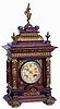 Lenzkirch, Germany, bracket clock, architectural oak case, heavily molded and with carved detail, mounted with a profusion of brass ornamentation including half caryatids, leaf and scroll feet, lion mask handles, and surmounted by a putto bearing a torch and wreath, Roman numeral brass dial, blued steel hands, 8 days time and strike movement, serial #616889, c1880