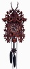 German, Black Forest cuckoo, smaller size but with highly detailed carving of edelweiss flowers, surmounted by a finely detailed stags head, c1920