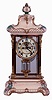 Ansonia Clock Co., New York, NY, "Crystal Regulator No. 3" in a gilt and brass case with a Royal Bonn top and base and a spring driven, 8 days, time and hour/half-hour strike movement with a visible escapement, c1906.