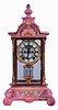 Ansonia Clock Co., New York, NY, "Crystal Regulator No. 4" in a gilt and brass case with a Royal Bonn top and base and a spring driven, 8 days, time and hour/half-hour strike movement with a visible escapement, c1914.
