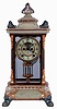 Ansonia Clock Co., New York, NY, "Crystal Regulator No. 6" in a gilt and brass case with a Royal Bonn top and base and a spring driven, 8 days, time and hour/half-hour strike movement with a visible escapement, c1906.