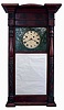 Asa Munger, Auburn, New York, so-called "Ironing Board Top" Empire carved column shelf clock with 8 day, weight driven, time and strike brass movement in a butternut case with mahogany veneer, c1830.