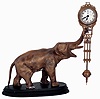 Clocks- 2 (Two) Asian reproductions of Junghans cast metal figure swinging arm, 8 days, clocks: elephant and Diana models, late 20th century