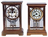 Clocks- 2 (Two): (1) Waterbury Clock Co., Waterbury, Conn., "Brest", 8 days, time and strike, spring driven brass movement crystal regulator mantel clock and (2) New Haven Clock Co., New Haven, Conn., "Thespia", 8 days, time and strike, spring driven brass movement crystal regulator mantel clock with visible escapement, both c1910.