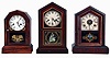Clocks- 3 (Three): (1) New Haven Clock Co., New Haven, Conn., "Tuscan", 30 hours, time and strike, spring driven brass movement mantel clock, c1890. (2) Atkins Clock Co., Bristol, Conn., 30 hours, time and strike, spring driven brass movement octagon top mantel clock, c1875. (3) William L. Gilbert Clock Co., Winsted, Conn., "Rocket", 30 hours, time and strike, spring driven brass movement mantel clock with alarm, c1880.