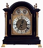 England, Victorian 3 train bracket clock, ebonized mahogany case in the Georgian style with gilt brass mounts and bracket feet, composite brass dial with Roman numeral silvered chapter ring, gilt spandrels, and matted center, strike controls in the arch, blued steel hands, substantial fusee movement with engraved back plate and pendulum, chiming the quarters on a nest of eight bells, and striking the hours on a large gong, c1880