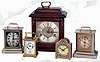 Clocks- 5 (Five) carriage, desk and mantel clocks: French, Duverdrey & Bloquel for J.E. Caldwell, 8 days, time and alarm brass and glass carriage clock; Mauthe German nickel-plate, 30 hours, carriage clock with music box (Home Sweet Home) in base; Ch.Hour, France, arch-top brass, 8 days, time only desk clock; Junghans nickel-plate, 30 hours carriage clock with music box (Carmen) in base; Western Germany hardwood, 8 days, triple-chiming bracket clock with Urgos floating-balance movement. all 20th century
