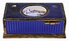 Switzerland, singing bird box, silver gilt case with blue guilloche enamel, oval lid with polychrome enamel harbor scene concealing a bird with brightly colored feathers, appearing and performing on demand, 4 1/8" x 2 1/8" x 1 5/8", 20th century