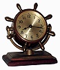 Chelsea Clock Co., Boston, Mass., "Comet", bronze on mahogany base, 8 days, time only swivel head yacht wheel desk clock, c1948