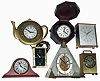 Clocks- 7 (Seven) small plug-in and battery-powered modern clocks: Movado and Luxor brass cases; Brookstone German boxed marine; Seiko pyramid; Israeli teapot wall clock; etc.