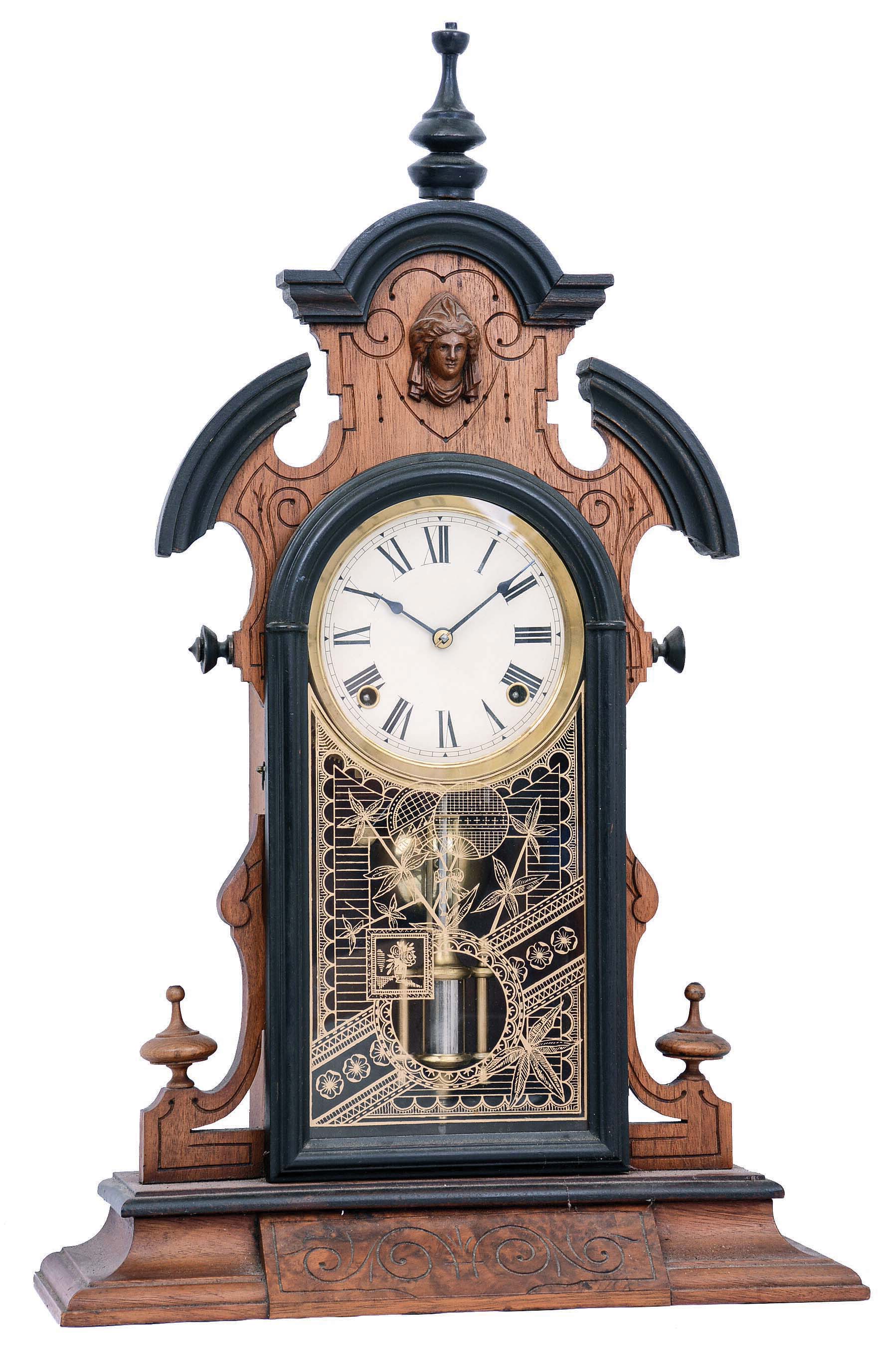 Clocks- 3 (Three): (1) F. Kroeber, New York, "Japanese" shelf clock with an 8 days spring driven brass time and strike movement in a walnut case. c1875. (2) George B. Owen, Winsted, Conn., "Panel" model shelf clock with an 8 day spring driven brass time and strike movement in a walnut case. c1878. (3) Unsigned, but New Haven Clock Co., New Haven, Conn., (similar to New Haven's "Apollo" model) miniature mirror side shelf clock with an 8 days spring driven brass time and strike movement in a walnut case, c1885; — Antique Clocks Price Guide
