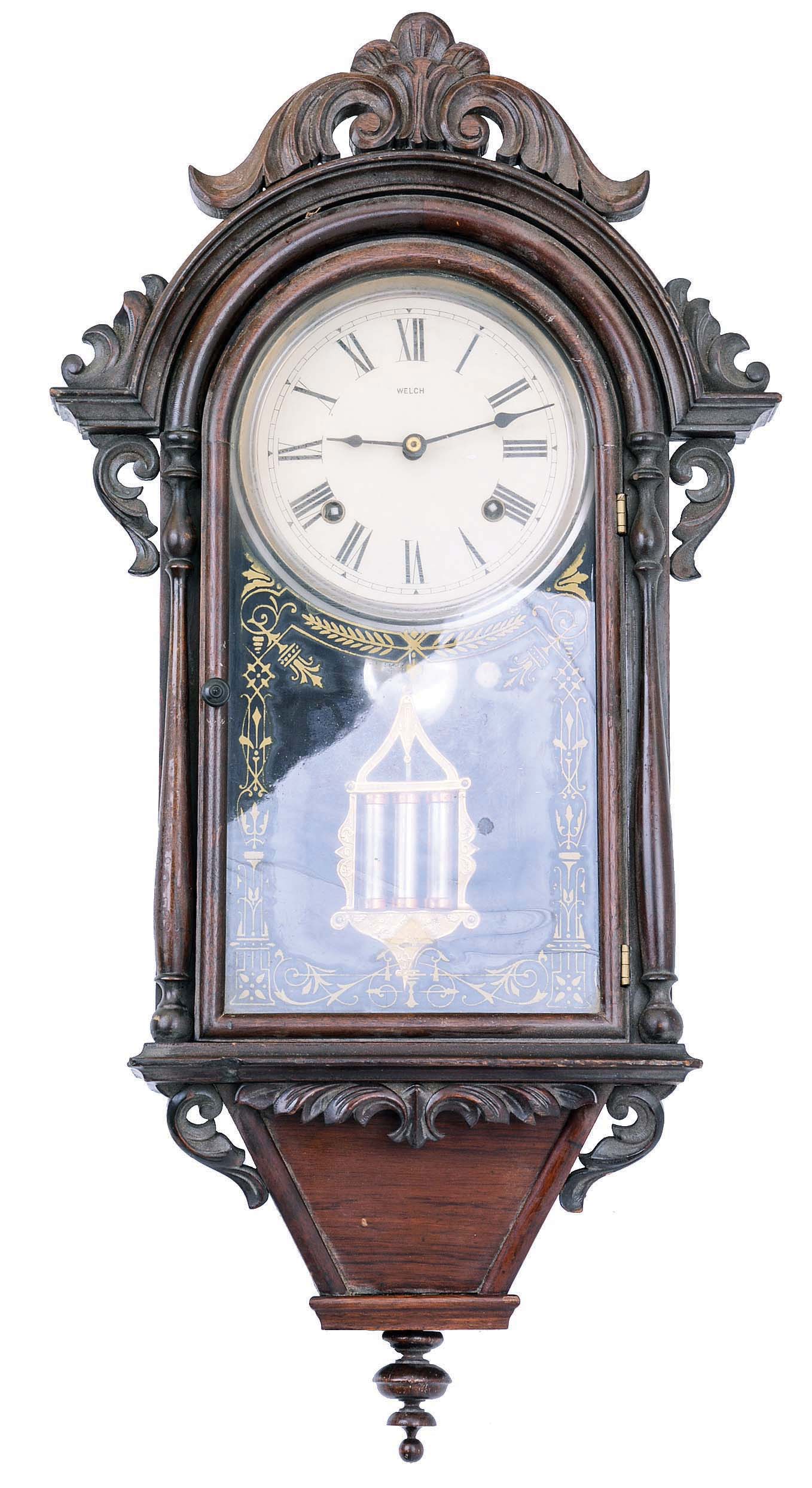 E. N. Welch Mfg. Co., Forestville, Conn., "Italian Hanging V. P." wall clock with an 8 days time and strike brass movement in a rosewood veneered case. — Antique Clocks Price Guide