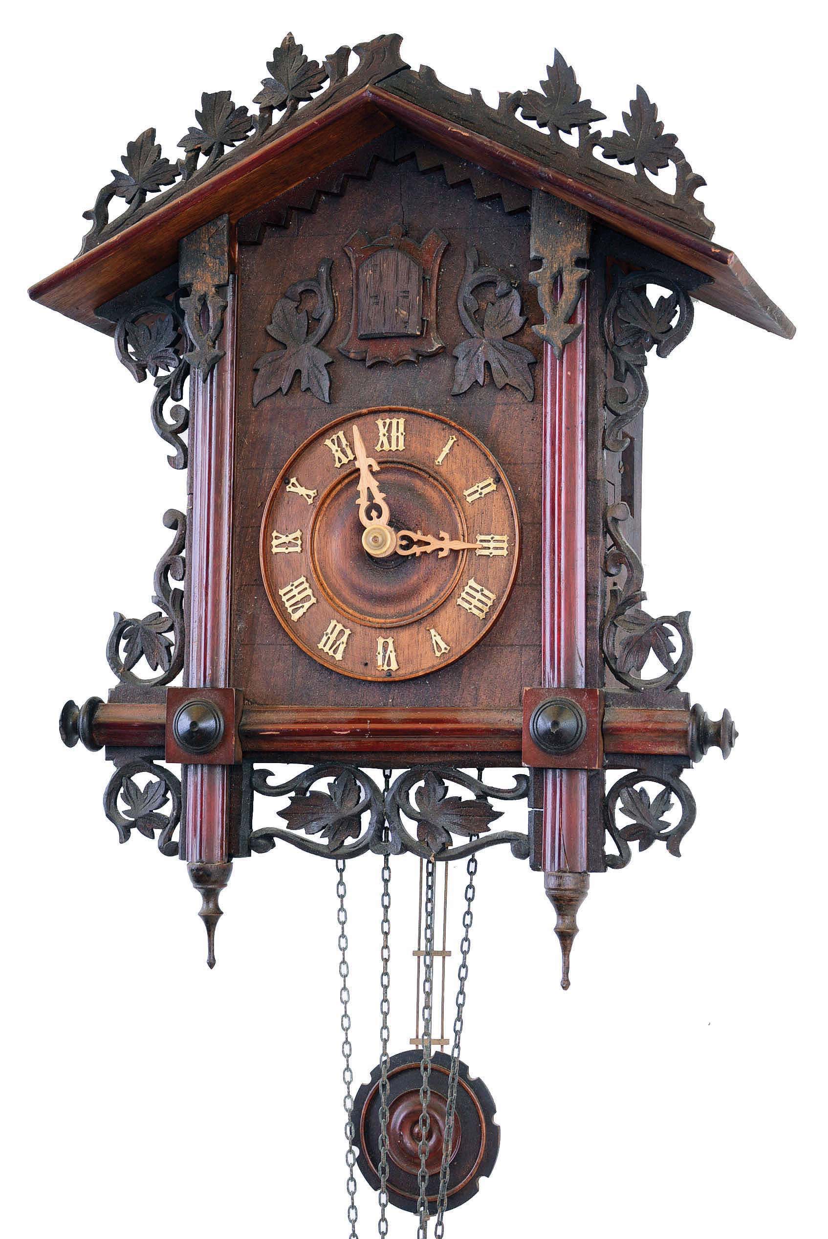 Clocks- 2 (Two) Cuckoo German 2 weight carved wood hanging clocks: (1) Gordian Hettich &amp; Sohn antique 30 hour railway style, c1900; (2) Schatz modern 8 day with hunter motif of rabbit, bird, guns, etc.; — Antique Clocks Price Guide