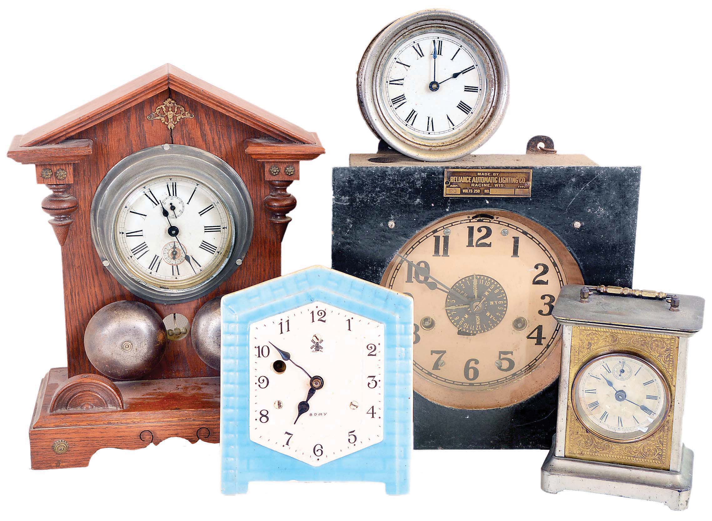 Clocks- 12 (Twelve): (1) Wooden works shelf clock with an unidentified Connecticut 30 hours time &amp; strike movement in an unusual mahogany veneered case. c1830; (2) Electric Light timer by Reliance Automatic Lighting Co., Racine, Wisconsin. (3) Oversized shelf model alarm clock of American origin; c1910. (4) Small electric clock of unknown manufacture; (5) Alarm clock mounted on wooden stand; manufacturer not identified; c1910; (6) Slave clock of unidentified origin.; (7) Waterbury Clock Co., Waterbury, Conn., "Tourist" carriage clock with a spring driven 30 hours time and alarm movement in a nickel plated case; c1891; (8) Small wall hanging timepiece with a blue and white porcelain dial likely of German or Dutch origin; (9) Western Clock Co., LaSalle, Illinois, "Westclox Alarm" with a 30 hours time and alarm movement; c1920; (10) Slave clock of unidentified origin (11) Modern day handmade copy of a J. C. Brown Acorn clock; (12) Standard Electric Time Co., Springfield, Mass. slave clock; — Antique Clocks Price Guide