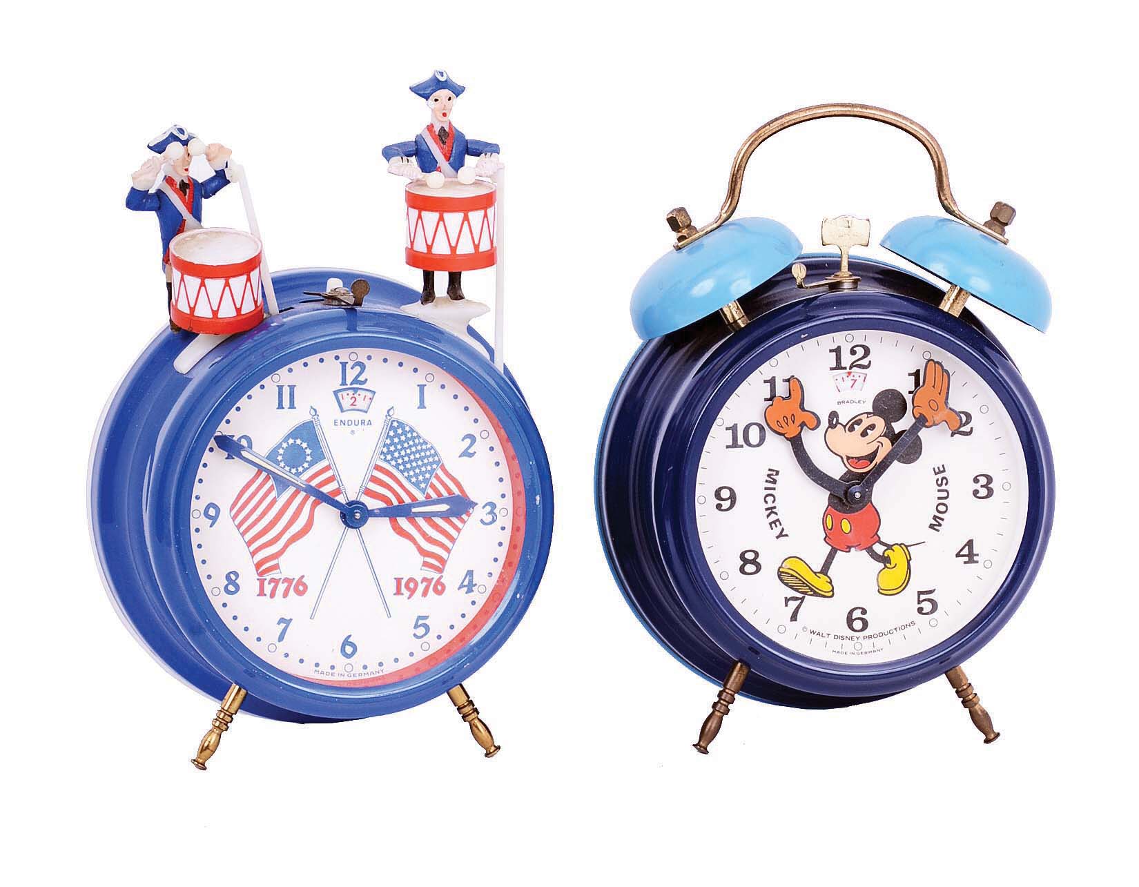 Clocks- 3 (Three): E. Ingraham &amp; Co., Bristol, Conn., "Treasure", (erroneously, but commonly called "Treasure Island") , 8 day, mahogany, time and strike, spring-driven banjo clock, c1934; two German painted metal alarm clocks - Mickey Mouse by Bradley and American Bicentennial by Endura, 3.5" dials, c1976 — Antique Clocks Price Guide