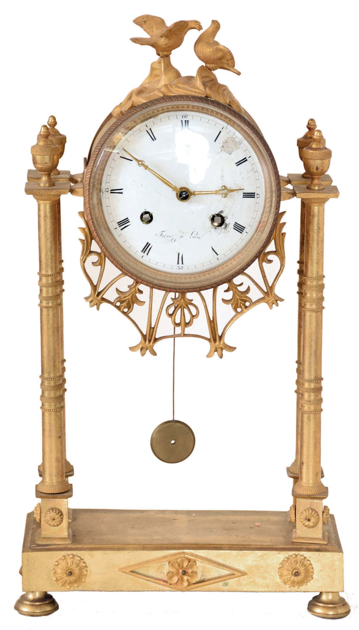 Feiver a Paris, France gilded brass architectural mantel clock, 8 days, time and bell strike, spring driven movement with silk thread suspension in a round case suspended above platform on four pad feet by four cast brass billars and surmounted by two doves. The white enamel dial is signed by maker. — Antique Clocks Price Guide