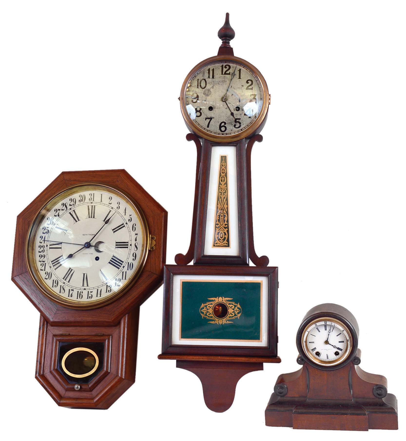 Clocks- 3 (Three) 8 day American wood: (1) New Haven "Waring" time and strike banjo, c1925; (2) Seth Thomas time and calendar drop octagon, c1920; (3) Seth Thomas Sons &amp; Co., New York, model #500, 8 (or 15) day, time &amp; strike mantel c1872. — Antique Clocks Price Guide
