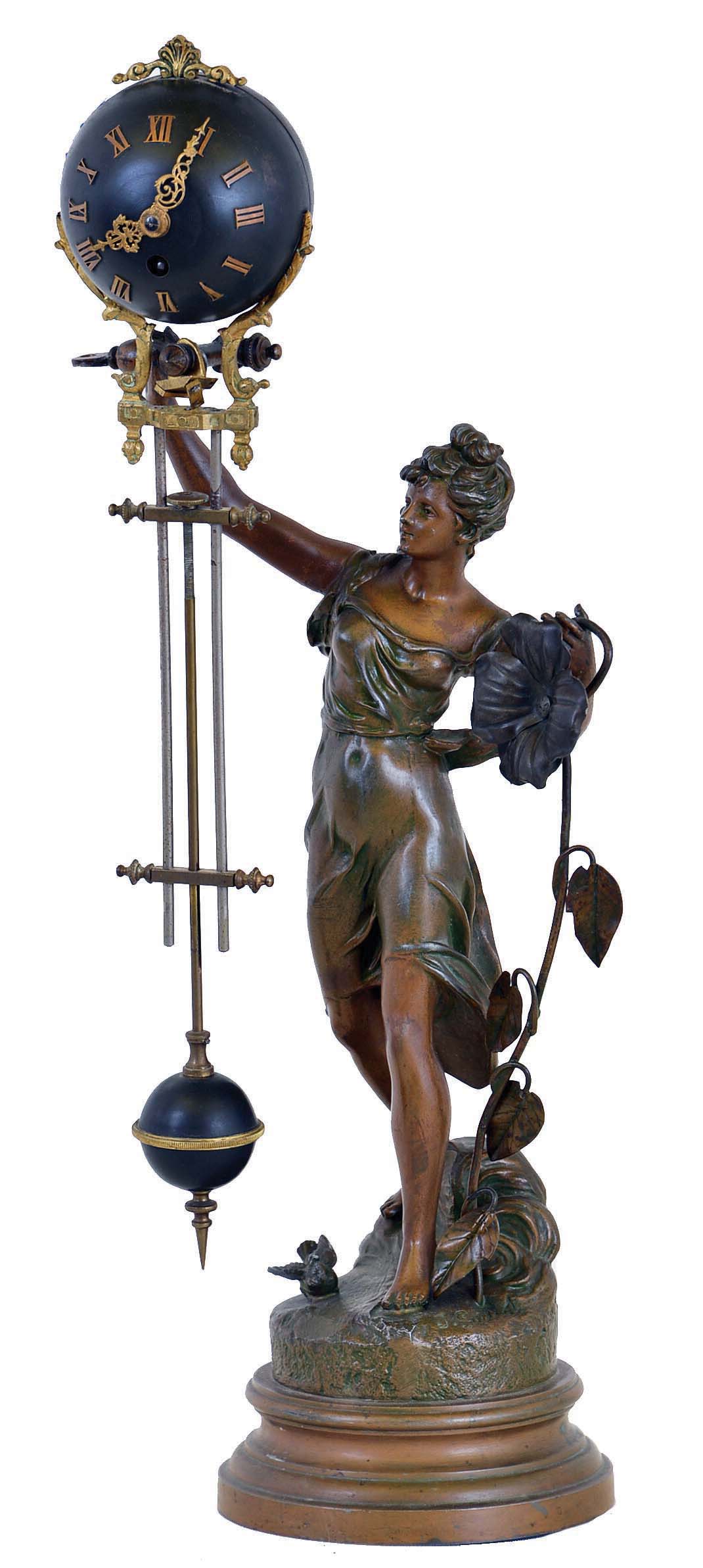 Swingers- 2 [Two] French, lot of small-medium ball style swing clocks, the movements contained within the brass spheres, suspended from the upraised arms of female statues. Larger figure is carrying a giant sea shell, the base signed "Reine des Flots, per Aug Moreau", smaller figure holds a large flower, unsigned. — Antique Clocks Price Guide