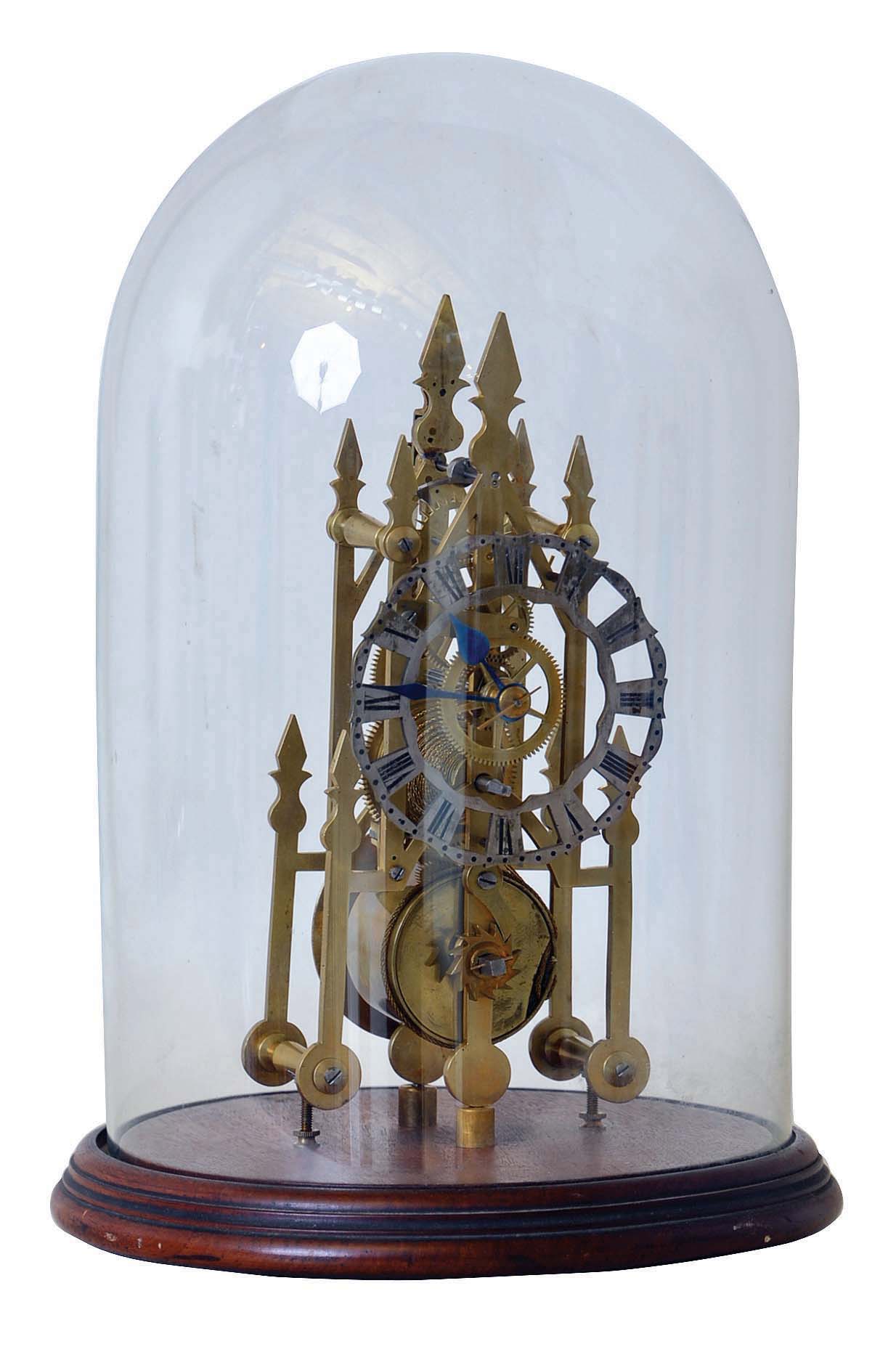 English, single fusee, skeleton timepiece in a cathedral shaped frame, with shaped baluster pillars, and with a round glass dome. — Antique Clocks Price Guide