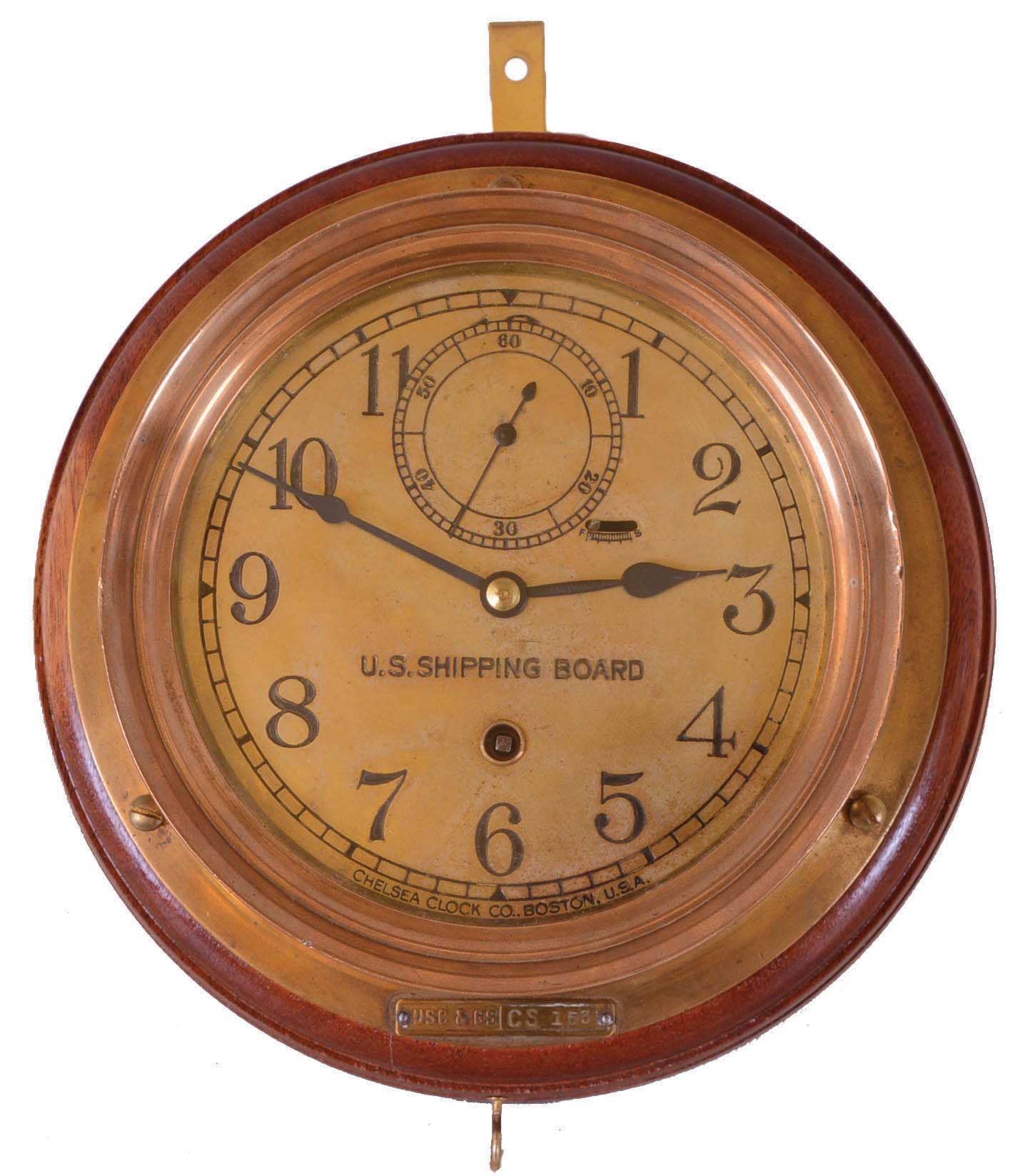 Chelsea Clock Co., Boston, Mass., 8 days, spring brass lever movement ward or engine room time piece. Serial No. 128125. Engraved on the dial: "U.S. Shipping Board". There is a tag on the case that reads: "USC &amp; GS CS 153". The US Shipping board was established in 1916 to address the eroding position of U.S. Shipping. It lasted until 1934 to be taken over by other government agencies — Antique Clocks Price Guide