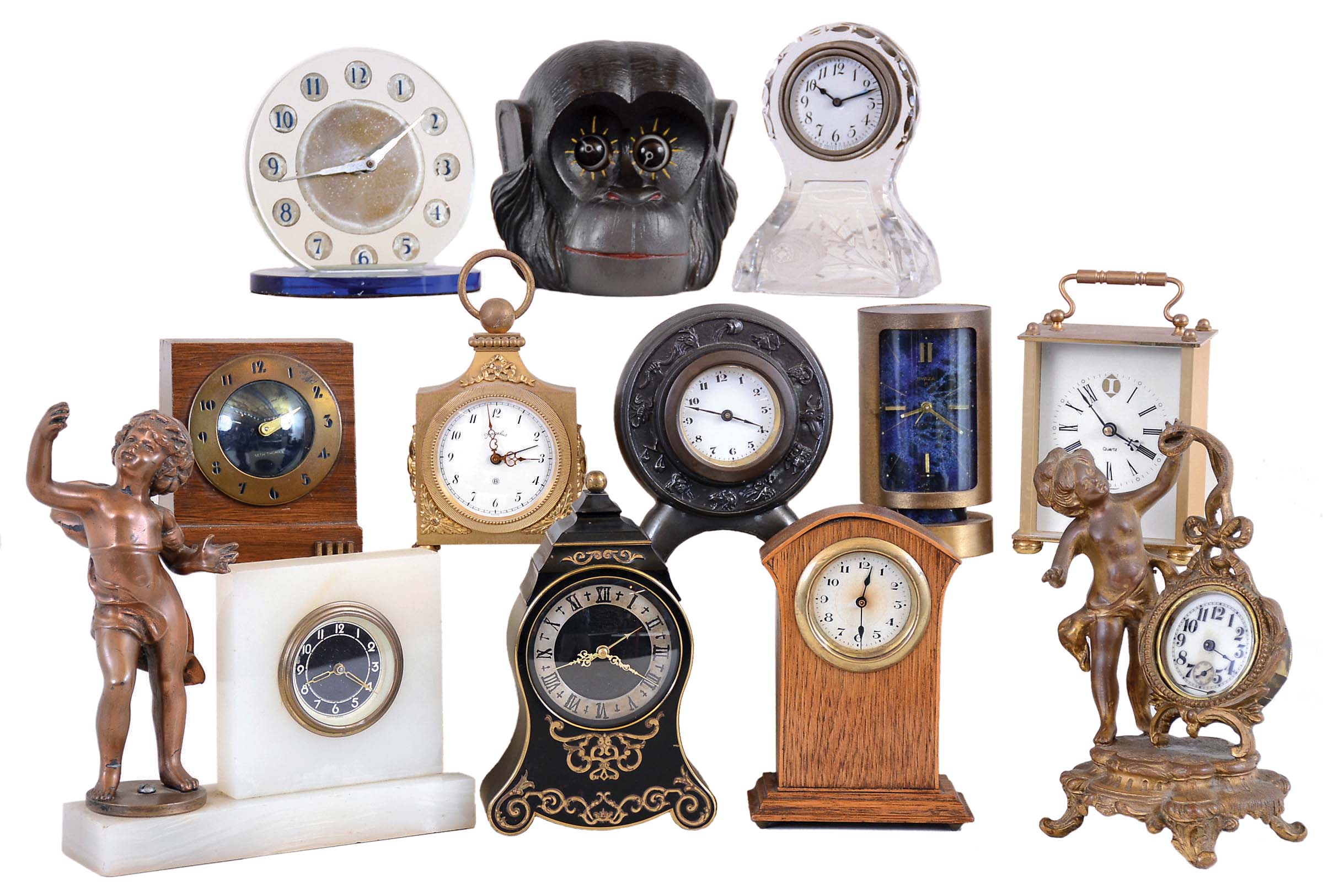 Clocks- 12 (Twelve) desk and novelty clocks, mostly vintage, some 8 day, some with marble and glass, a few modern quartz. Maker and seller names include Swiza, New Haven, Jaeger, Angelus, Seth Thomas, The monkey head with rotating eyes is unsigned. — Antique Clocks Price Guide