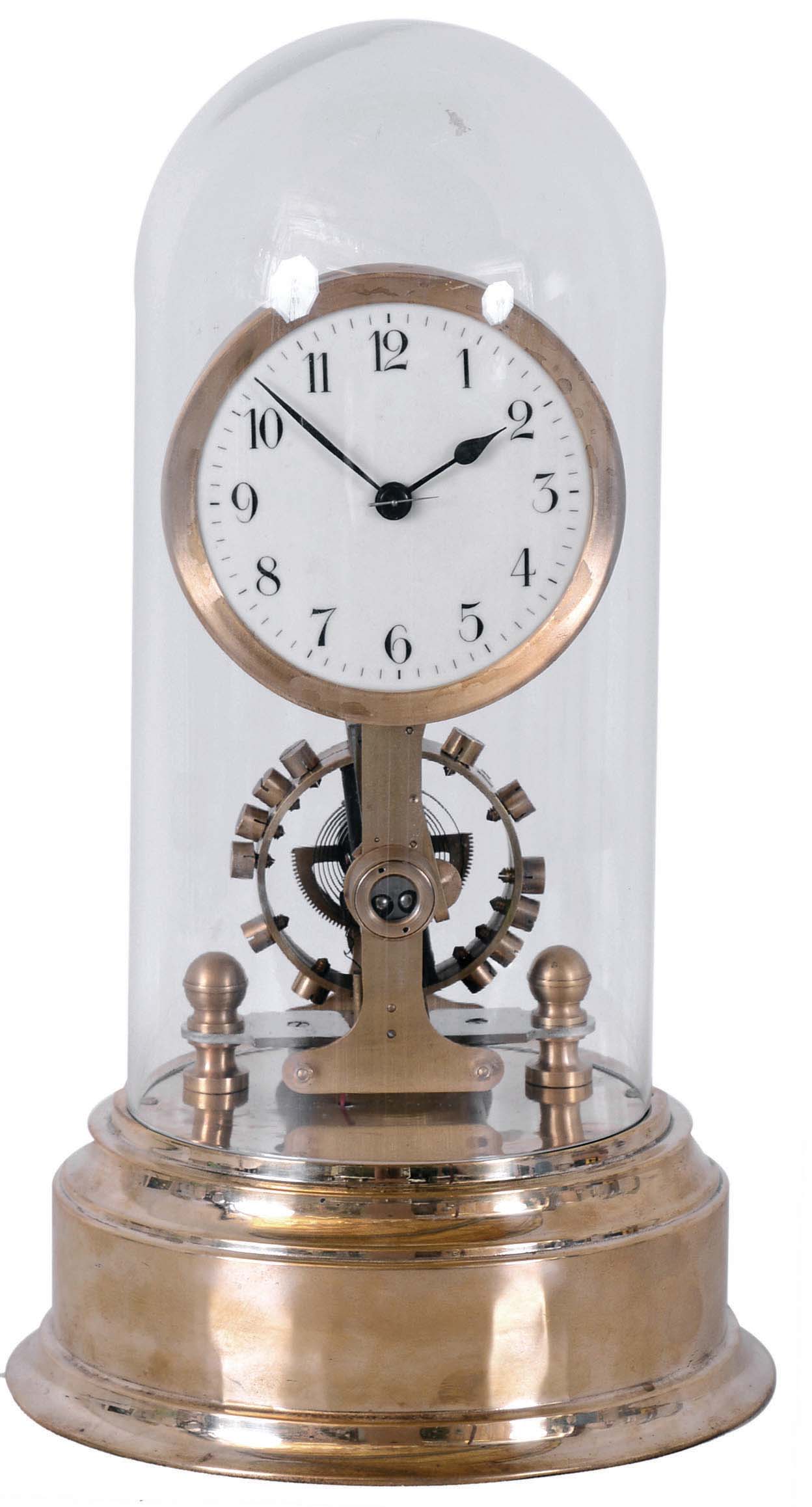German Eureka, battery powered, electro-magnetic timepiece mounted on brass base under dome with large exposed rotating balance. — Antique Clocks Price Guide