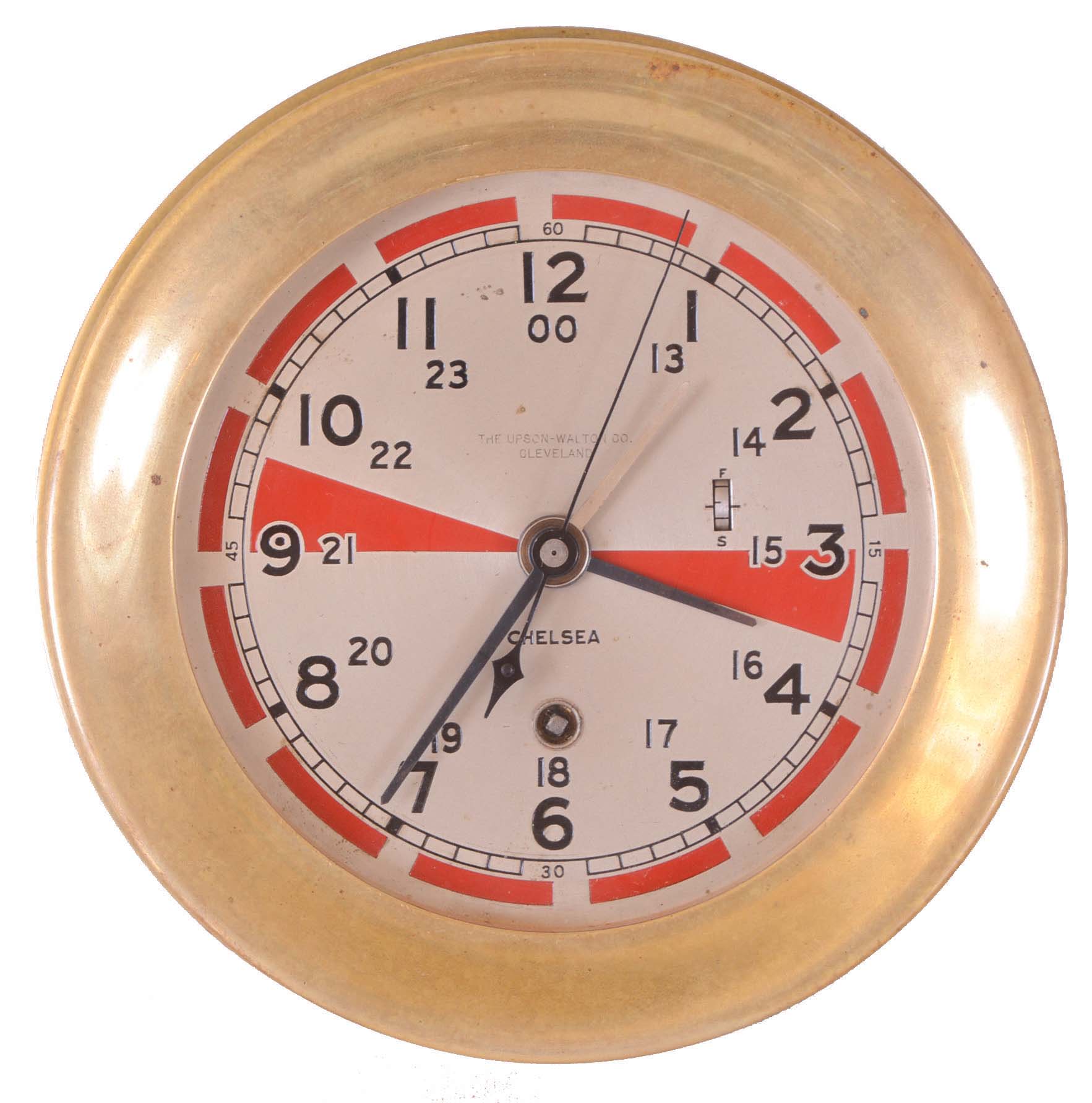Chelsea Clock Co., Boston, Mass., 8 days, spring brass lever movement ward or engine room timepiece retailed by The Upson-Walton Co., Cleveland. Serial No. 248566. This example 12/24 model with a secondary hand for Greenwich Mean Time (GMT) referred to as "Zulu" by maritime shipping. The red sections reflect periods of silence observed by radio operators to monitor airwaves for distress signals. — Antique Clocks Price Guide