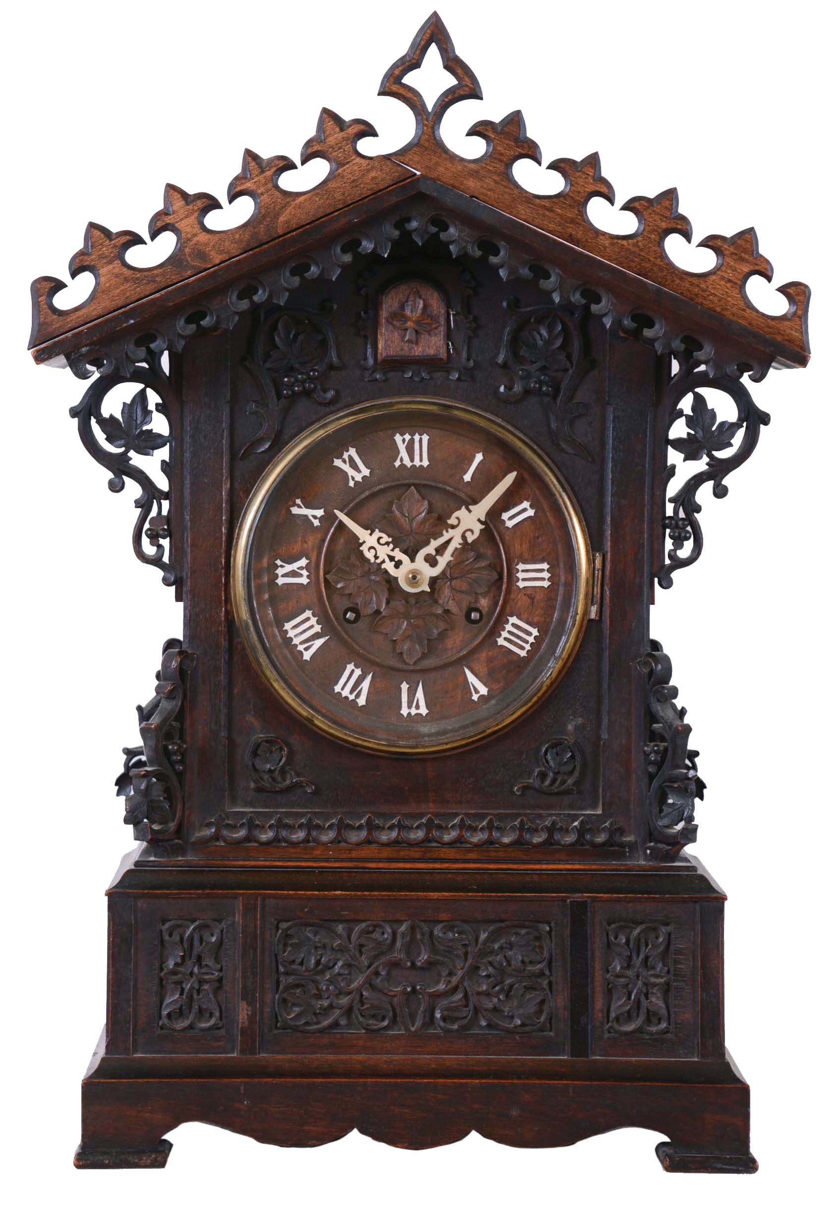 Johann Baptiste Beha, Germany, for Camerer, Kuss &amp; Co., shelf cuckoo, architectural walnut case with inset panels containing carved trailing vine and leaf ornament, carved buttress corners, and repeating carved fleur de lys trim above and below gable, wooden dial with applied Roman numerals, with protective glass set in a brass bezel, pierced bone hands, full bodied wooden bird, large 8 day, time and strike fusee movement with brass plates, brass pendulum, case back with Camerer, Kuss &amp; Co. label — Antique Clocks Price Guide