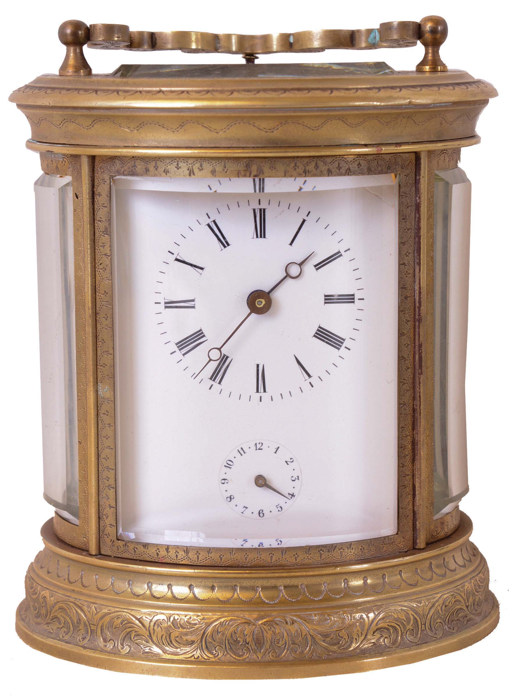 Switzerland, hour repeating carriage clock, oval case with beveled glasses and acanthus engraved top and base molding, Roman numeral, white enamel dial with subsidiary alarm chapter, blued steel Breguet style hands, 8 day time, strike, and alarm movement with lever platform, counting the hours on a gong, and repeating on demand, strike work planted on back plate, gong and hammer behind dial, and alarm bell in the base — Antique Clocks Price Guide