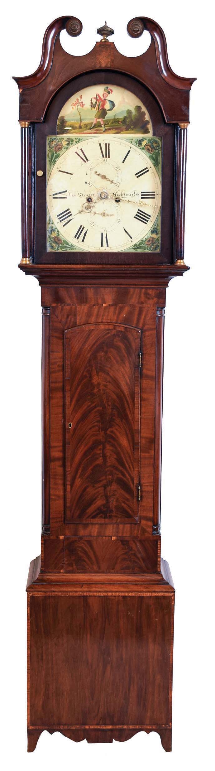 John Stewart, Auchterarder, Scotland, tall clock, 8 day, time and strike, weight driven movement in an mahogany veneer case with broken arch with brass rosettes, two full columns with brass capitals and bases flanking hood and Hepplewhite cutout bracket feet. The painted iron dial has a calendar, second's bit, painting in arch of a Scottish lad doing a Highland fling (jig) and cutout brass hands. — Antique Clocks Price Guide