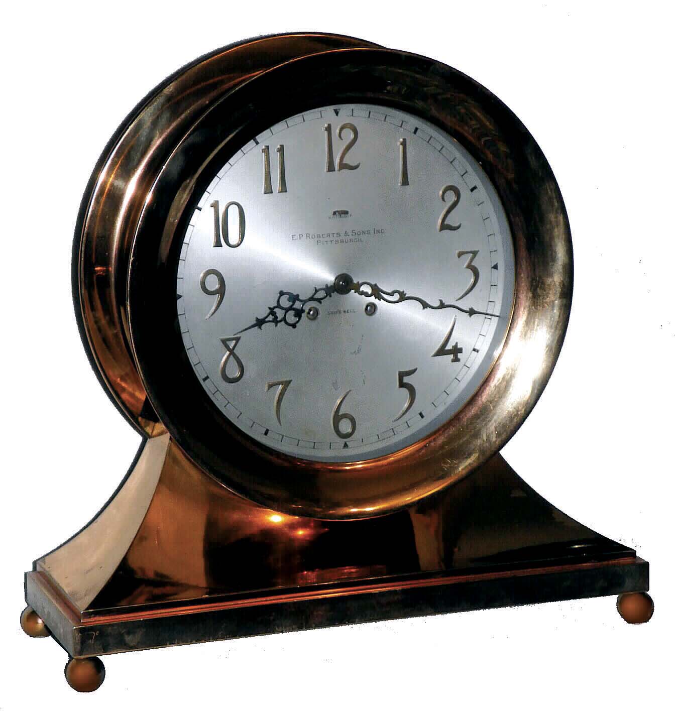 Chelsea Clock Co., Boston, Mass., Mass, a base and ball special "Commodore" ship's bell clock with ten inch dial {24.5cm}, in a red brass case with hinged bezel &amp; button latch, retailed by E. P. Roberts &amp; Sons, Pittsburgh as indicated on dial. — Antique Clocks Price Guide