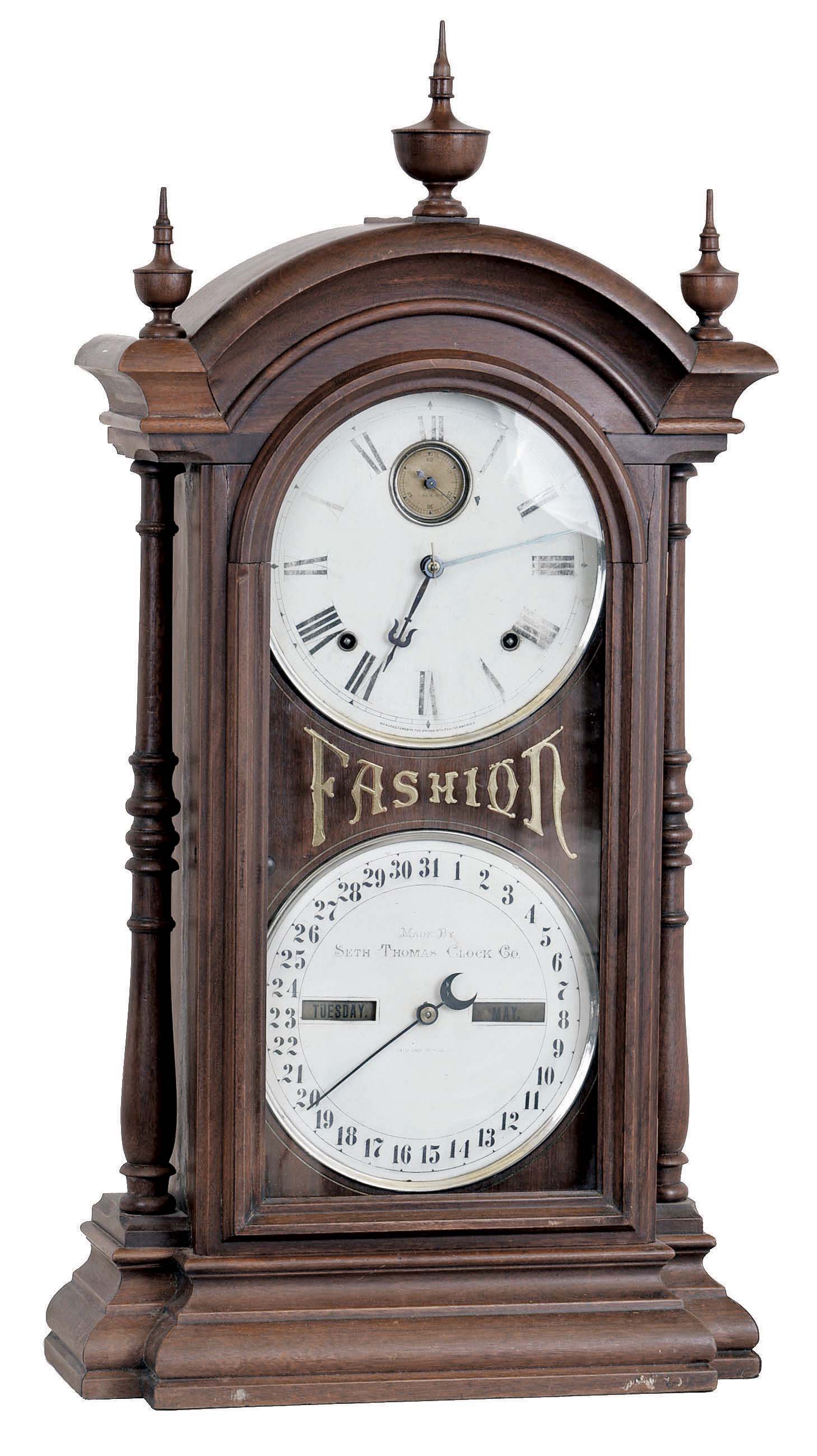 Seth Thomas Clock Co., Thomaston, Conn., "Fashion No. 5", 8 day, time and strike spring driven brass movement (with seconds bit) double dial calendar clock in a walnut case. — Antique Clocks Price Guide