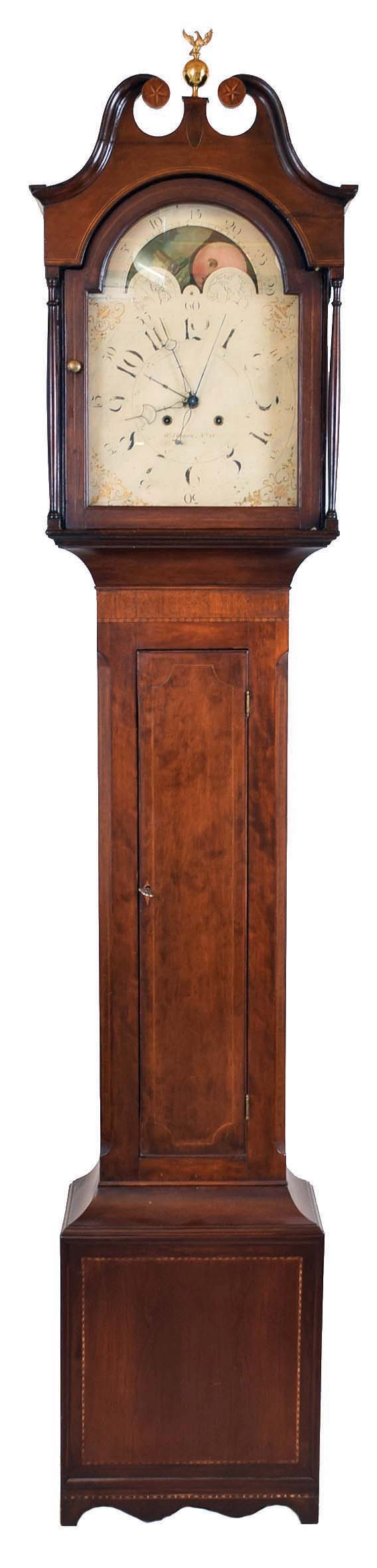 William Herwick (Sr.) , Greensburg, Penn., "No. 15" tall case clock, 8 day, time and strike, weight driven movement in a cherry case with broken arch top, center brass eagle finial, star inlaid rosettes and four full columns flanking hood, string inlaid doors and cross hatching on trunk and cutout bracket base with inlaid panel. The painted metal dial with maker's signature has date calendar, sweep seconds and moon phase. The dial's false plate is signed "PATTON &amp; JONES PHILA". — Antique Clocks Price Guide