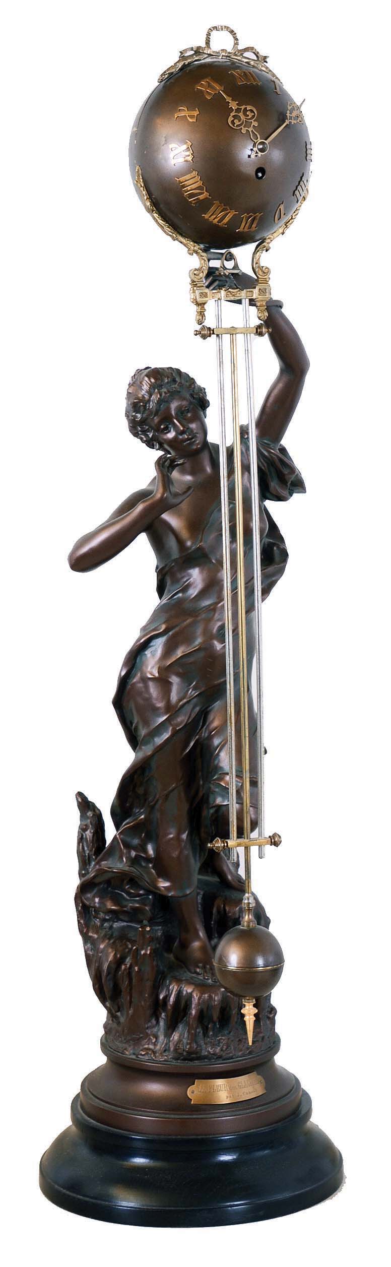 French large swinger mystery clock, gilt and patinated figure "La Fleur Des Glaciers", after sculptor J. Causse, with female figure descending a natural staircase, supporting the extra long 34" clock and compound pendulum arm, spherical case with bow-knot-ribbon ornament, applied Roman numerals and Louis XV style hands containing the 8 days, time only movement, gridiron style assembly with ornamented smaller sphere at bottom, all mounted to a ebonized wooden base — Antique Clocks Price Guide