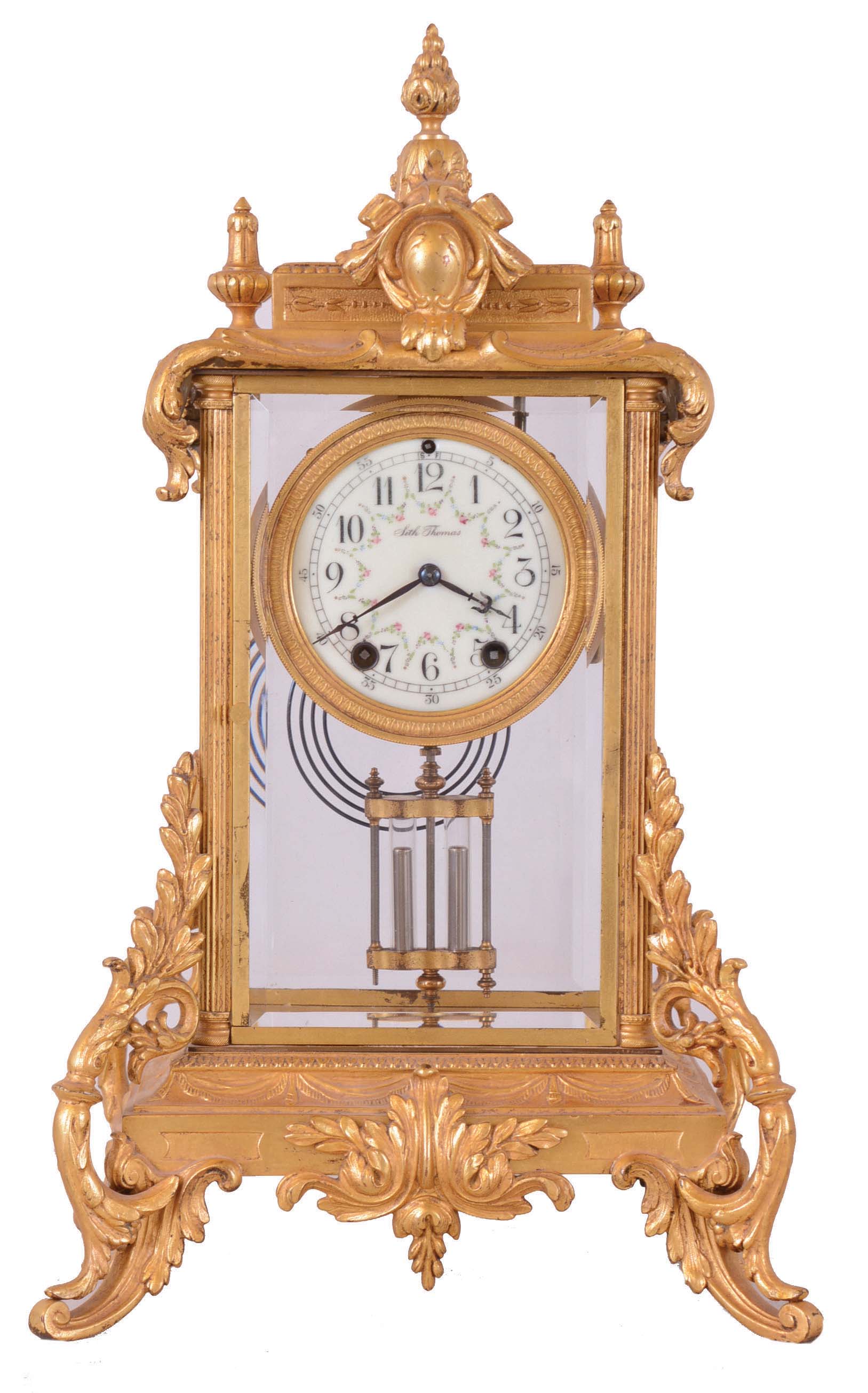Seth Thomas Clock Co., Thomaston, Conn., "Empire No. 27" Crystal Regulator shelf clock with a spring driven 8 day time and half hour strike movement in a gilt case. — Antique Clocks Price Guide