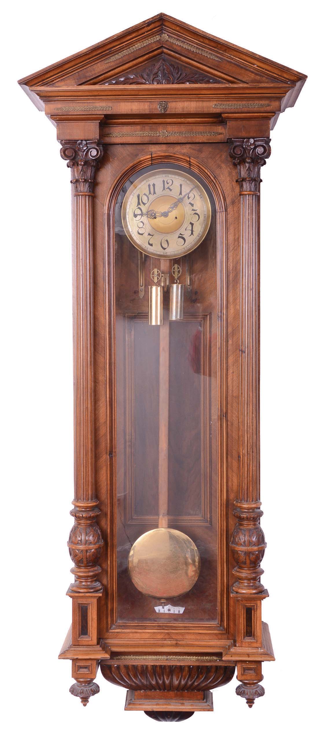 Massive architectural Vienna Regulator case with associated movement. The mahogany veneer case is in the Alt Deutsch style with a pitched pediment top, fluted 3/4 round Deutsch topped by carved Corinthian capitals and bulbous bases over a stylized base. — Antique Clocks Price Guide