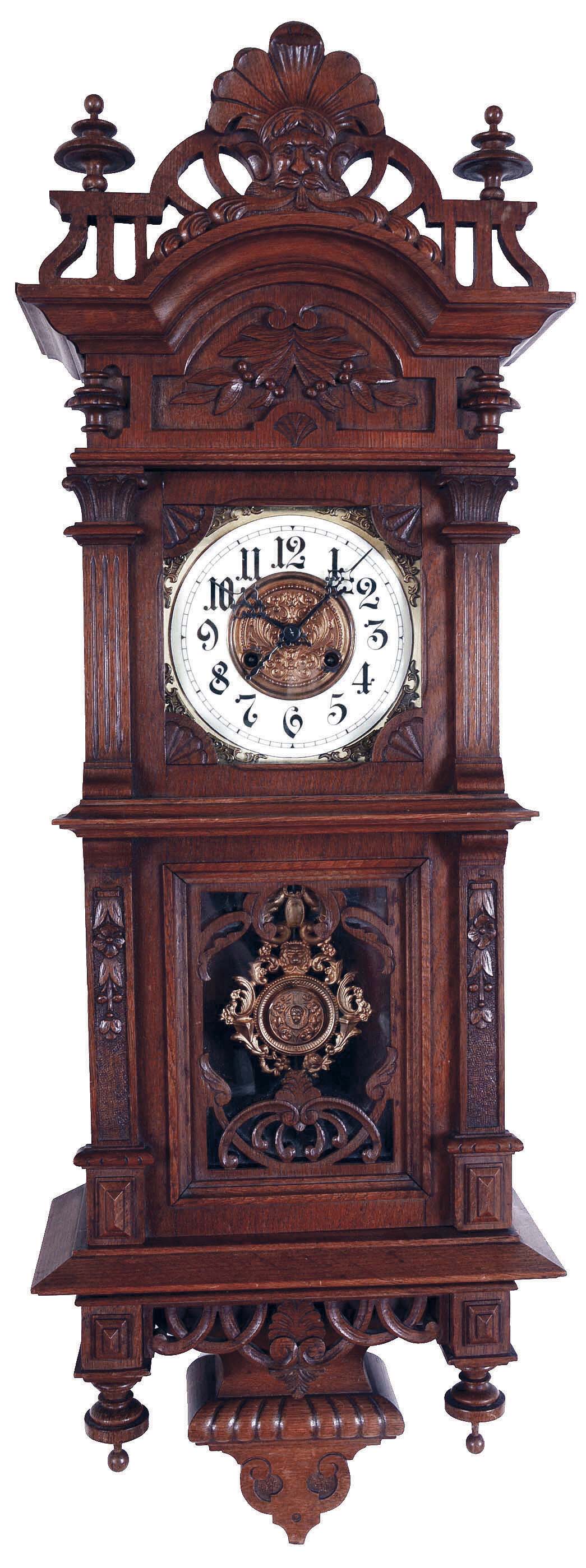Germany, unsigned Vienna regulator, 8 days, time and strike with bim bam strike, spring driven movement in a carved oak case with carved top, bottom and finials and two part brass and enamel dial and stamped brass pendulum. — Antique Clocks Price Guide