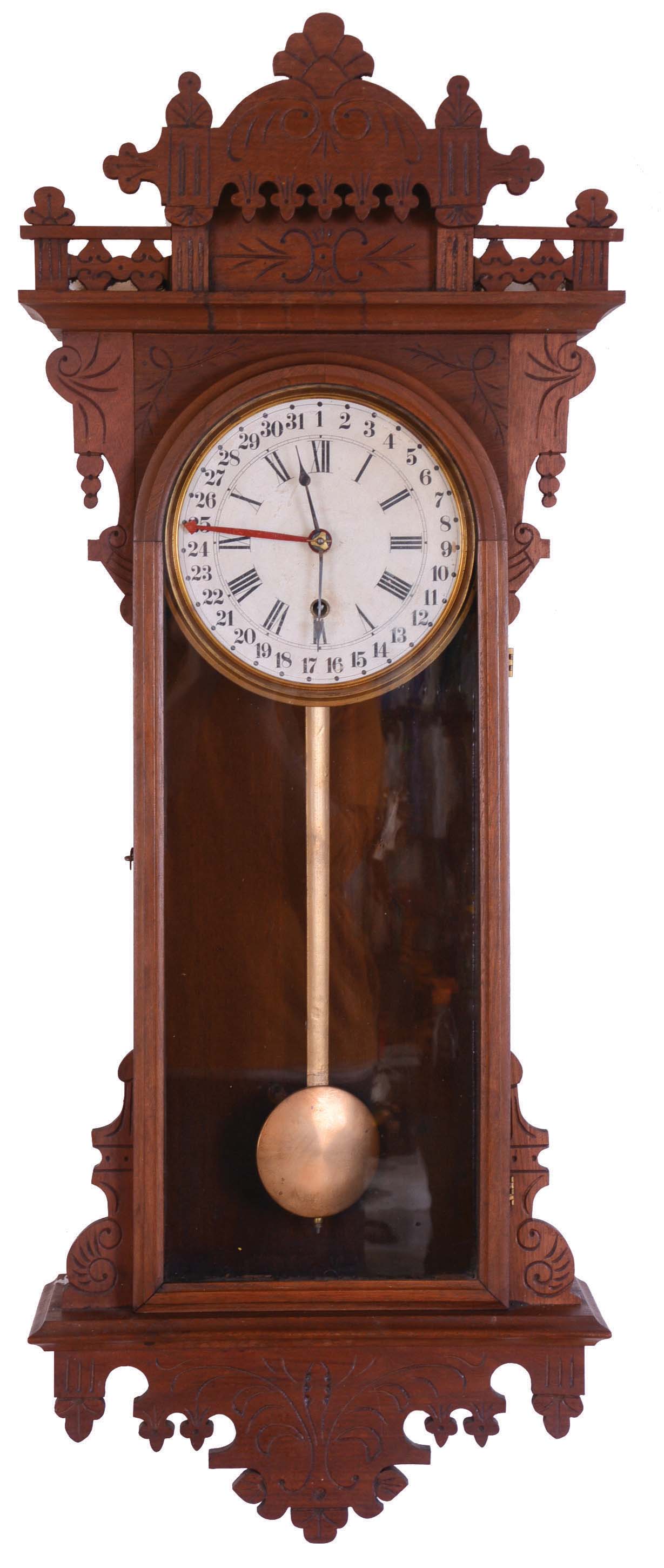 E. N. Welch Mfg. Co., Forestville, Conn., "Eclipse" wall hanging clock with a spring driven 8 day timepiece movement with a simple calendar mechanism in a walnut case. — Antique Clocks Price Guide