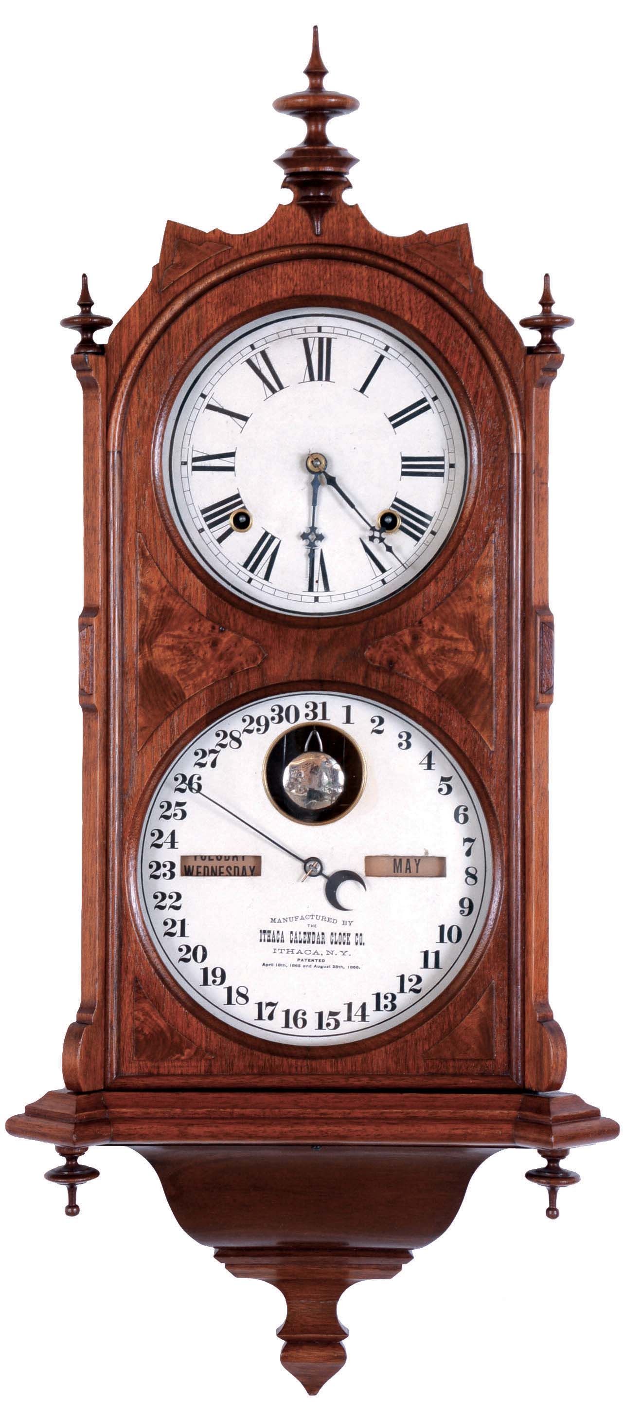 Ithaca Calendar Clock Co., Ithaca, NY, "Hanging Cottage No. 7" wall hanging clock with a spring driven 8 day time and strike movement with a perpetual calendar mechanism in a walnut case. — Antique Clocks Price Guide