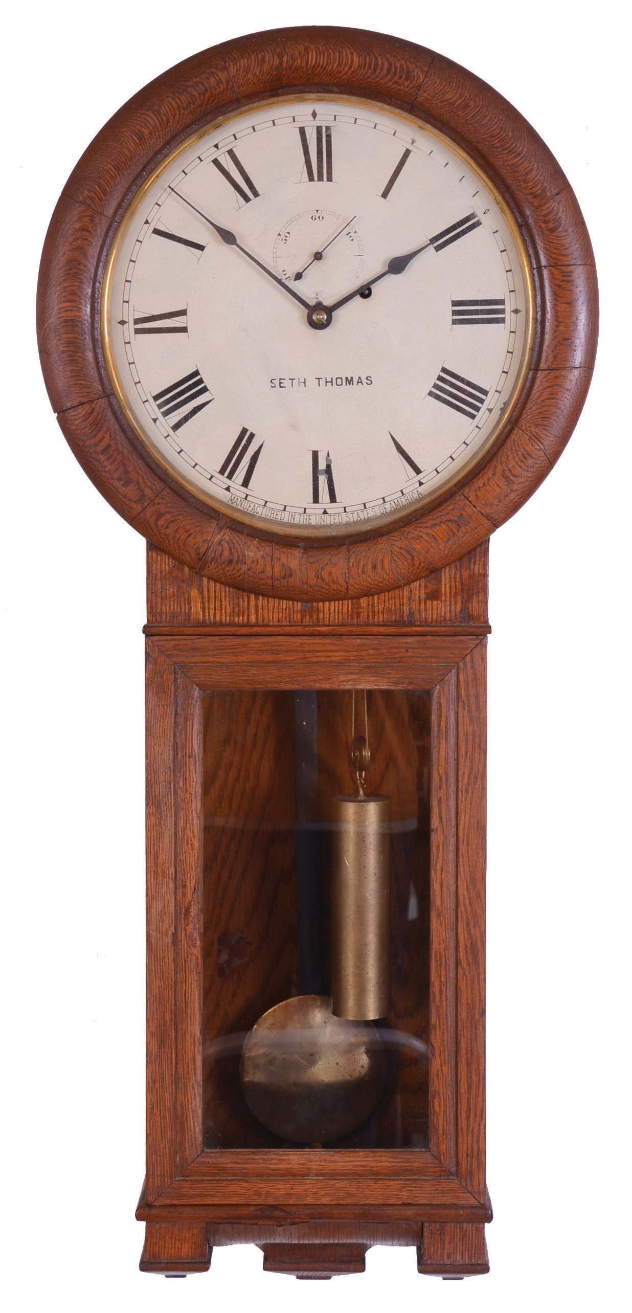 Seth Thomas Clock Co., Thomaston, Conn., "Regulator No. 2" wall hanging clock with a weight driven 8 day timepiece movement in a oak case. — Antique Clocks Price Guide