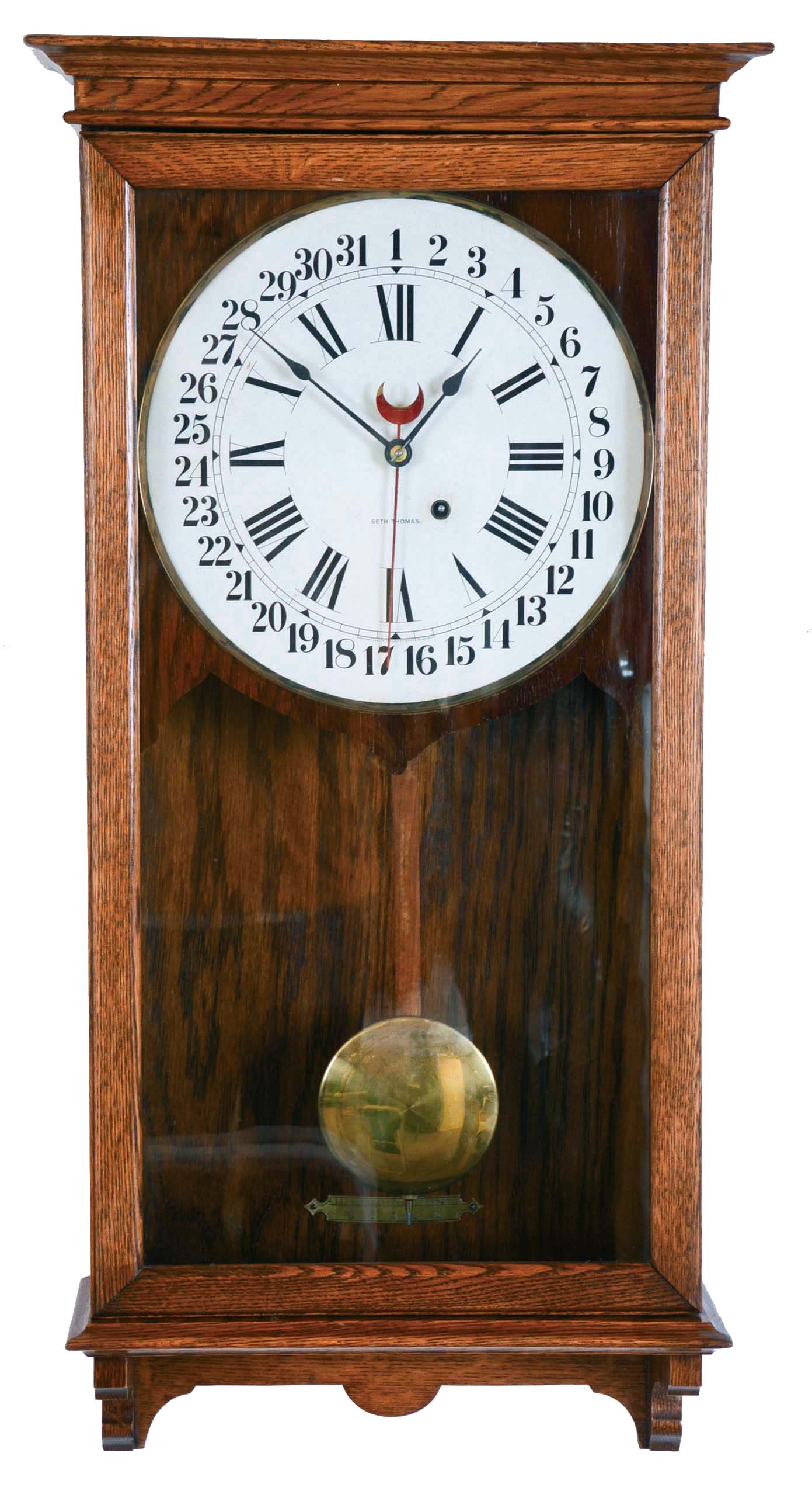 Clocks- 2 (Two): (1) Seth Thomas Clock Co., Thomaston, Conn., wall hanging clock with a spring driven 8 day timepiece movement with a simple calendar mechanism in a solid oak case. c1920. (2) Seth Thomas Clock Co., Thomaston, Conn., "Senate 5W" wall hanging clock with a spring driven 8 day timepiece movement in a solid oak case. c1940. — Antique Clocks Price Guide