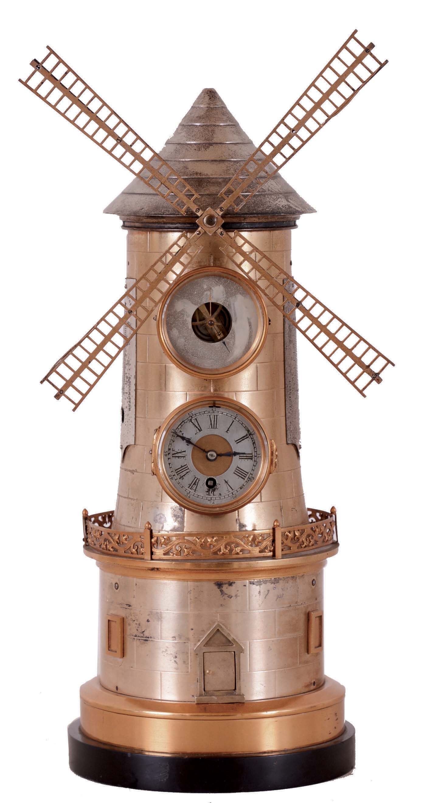 France, industrial series, The Windmill , the gilt and silvered brass case with black slate base, mid section with pierced railing, lower section with two simulated windows flanking a door, the door opening to access the windmill movement winding arbor, front with 8 day timepiece and barometer, the sides with farenheit and centigrade thermometers, c1880 — Antique Clocks Price Guide