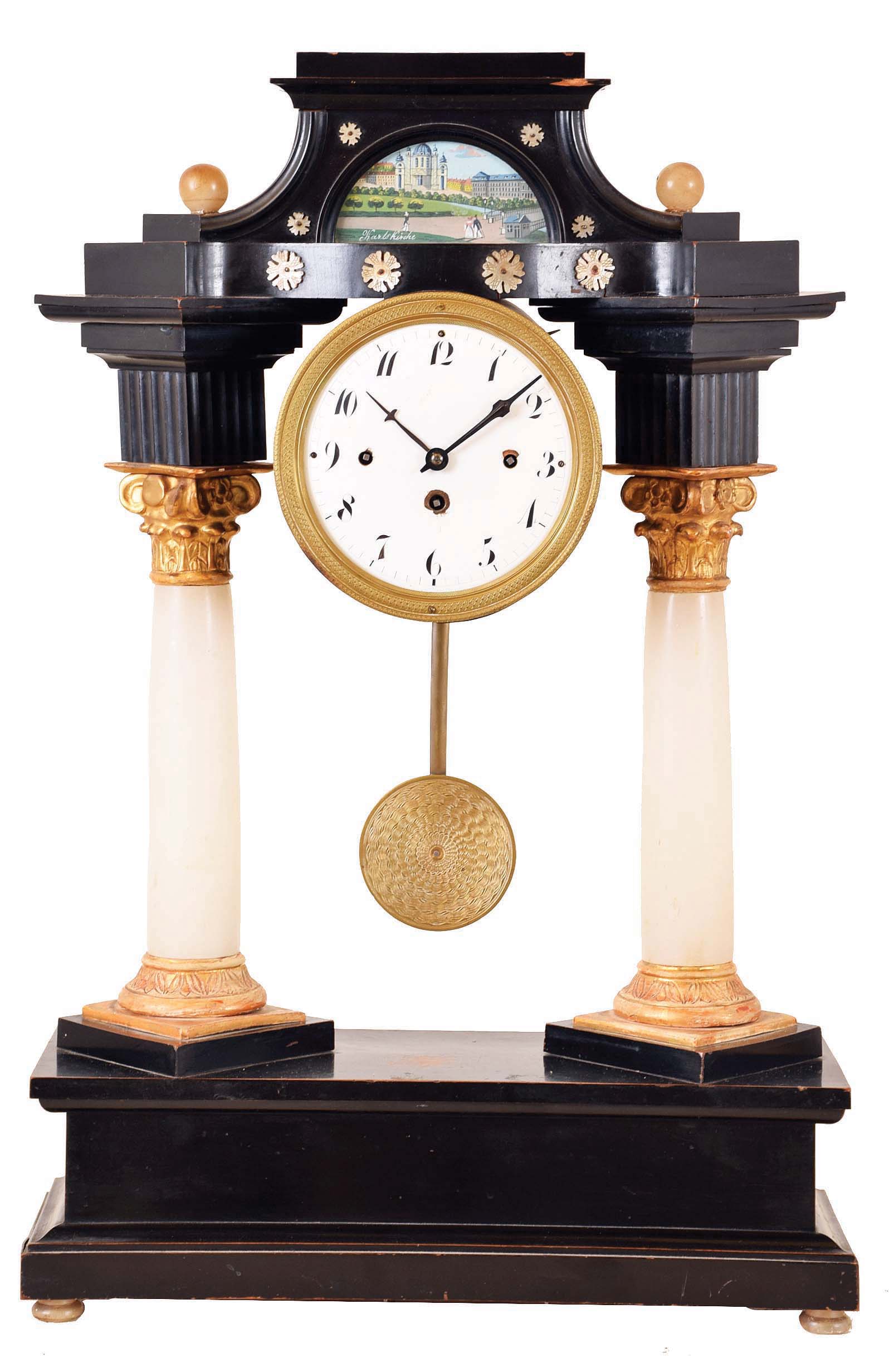 Austria, mantel or shelf clock with music box, ebonized portico style case, alabaster columns with gilt, carved capitals and bases, case top with watercolor painting behind glass of St. Charles Church, Vienna, and mother of pearl ornaments, all on an oblong base containing a two tune music box, activated by pulling a string, and Arabic numeral white enamel dial, steel hands, two day grand sonnerie striking brass movement, engine turned brass pendulum, inside of case and inside of back with handwritten labels — Antique Clocks Price Guide