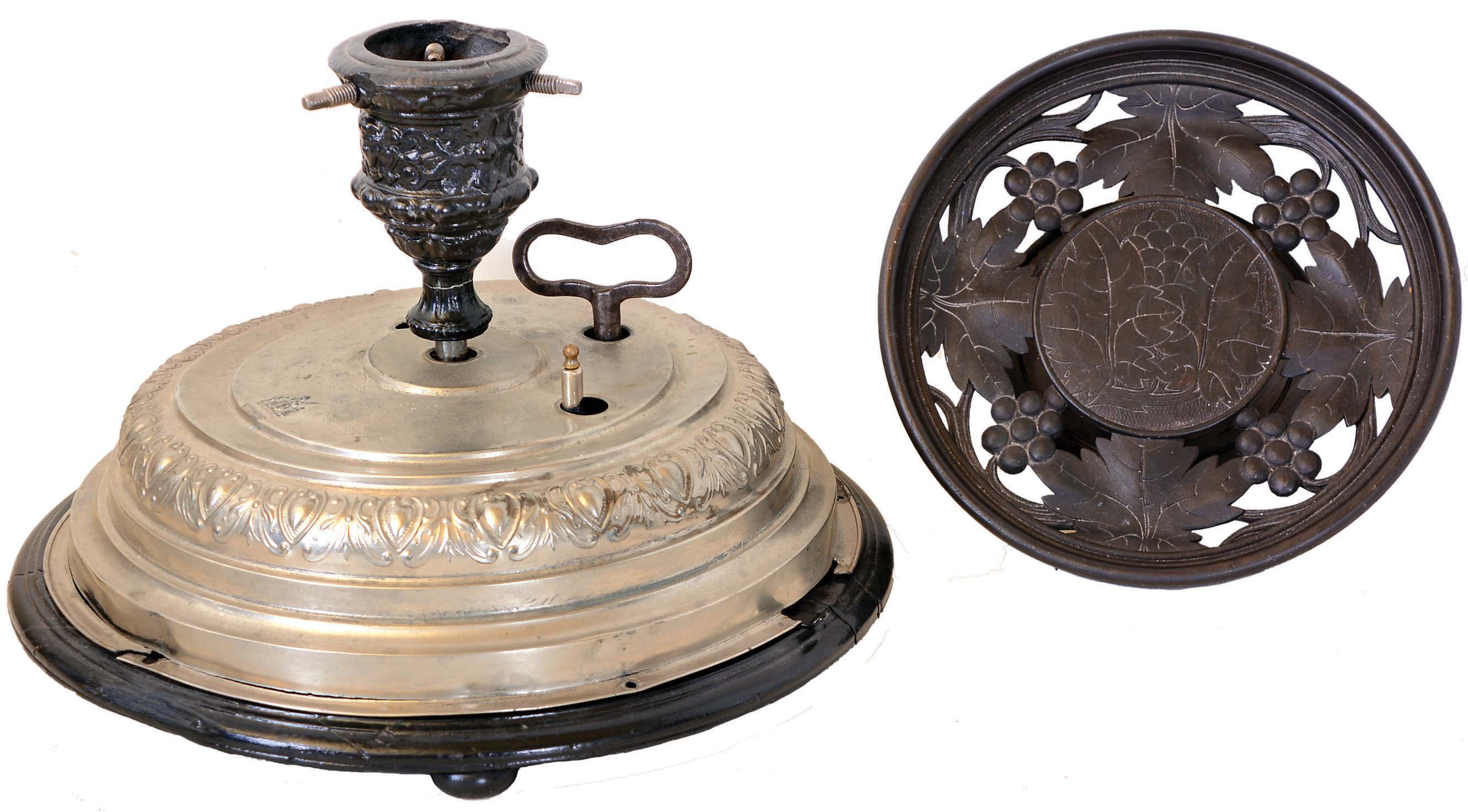 Musical Items - 2 (Two): German Victorian Christmas tree rotator with music box, nickel plated top, black painted wood base; German carved wood round platter holder, music commences when holder is lifted. — Antique Clocks Price Guide