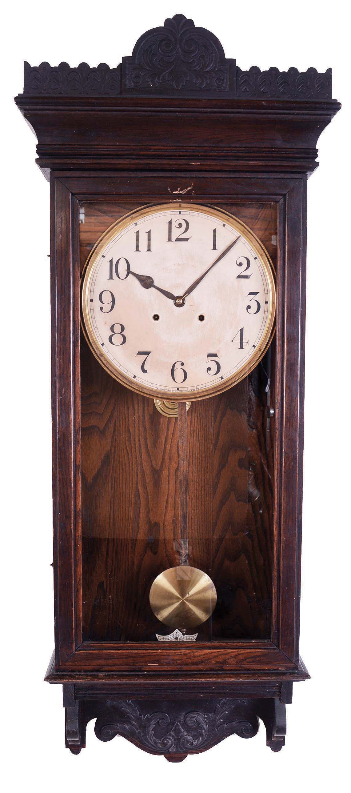 Waterbury Clock Co., Waterbury, Conn., "Postal" wall hanging clock with a spring driven 8 day time and strike movement in an oak case. — Antique Clocks Price Guide