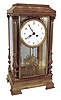 France, extra large "crystal regulator", the dial surrounded by a fancy cast and gilt bezel, the pendulum of sun-burst motif, and the case corners with full Corinthian reeded columns, and all sides with heavy beveled glass, the 5.6" porcelain dial with Arabic numerals and finely pierced hands, c1850