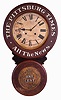 Baird Clock Manufacturing Co., Plattsburgh, New York, "Pittsburg Times", advertising wall clock, 8 days, time and strike, spring driven Kroeber movement in a painted mixed wood case with paper mache doors displaying embossed advertising including the reverse side of an Indian Head Penny on the lower door and "ALL THE NEWS" on the upper door with papered metal dials