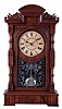Seth Thomas Clock Co., Thomaston, Conn., "Hecla" mantel clock in a walnut case with a three train, 8 days, spring, time and strike movement, striking the quarter hours on 2 cup bells and the hours on a cathedral bell, c1885.