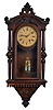 Seth Thomas Clock Co., Thomaston, Conn., wall clock in a walnut case with a spring driven, 8 day, timepiece movement, c1874.